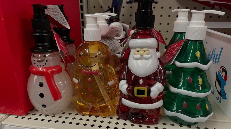 Four Christmas-shaped hand soap dispensers