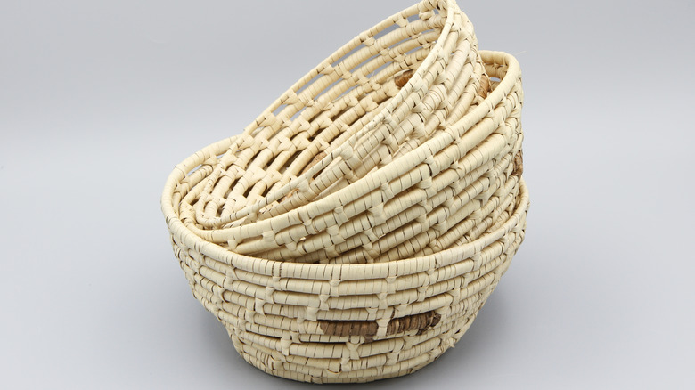 A stack of three woven baskets