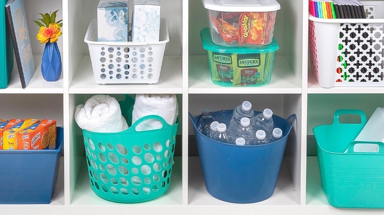 Colorful baskets and tubs being used for storage
