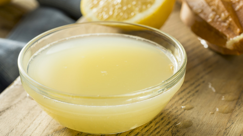 Freshly squeezed lemon juice in clear, glass bowl