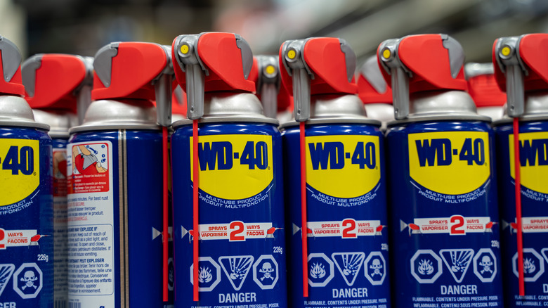 Closeup of WD-40 cans on store shelf