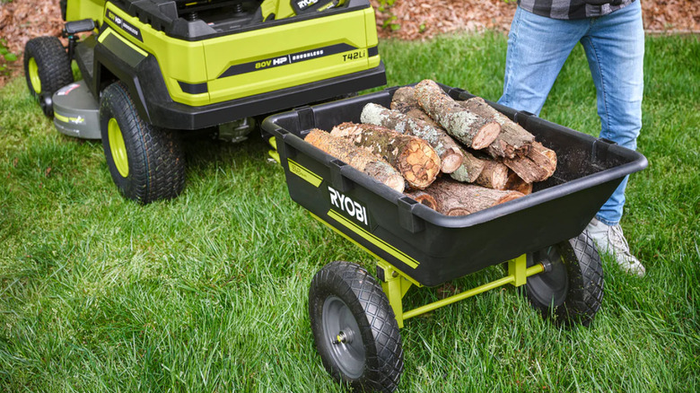 Chopped wood in the Ryobi Tow-Behind Dump Cart.