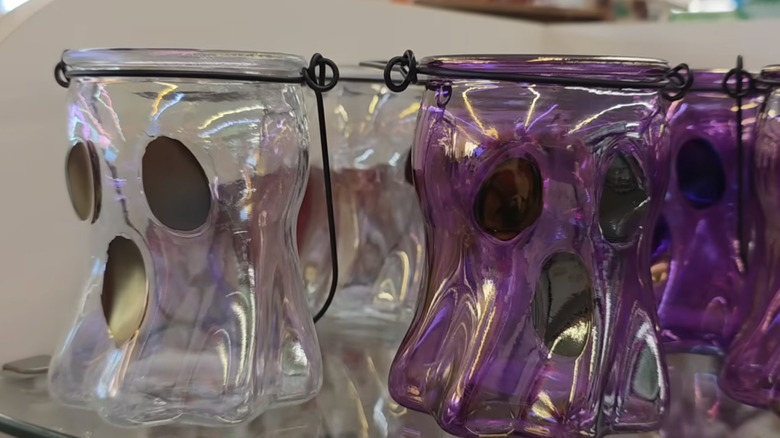 Clear and purple glass candle holders shaped like ghosts