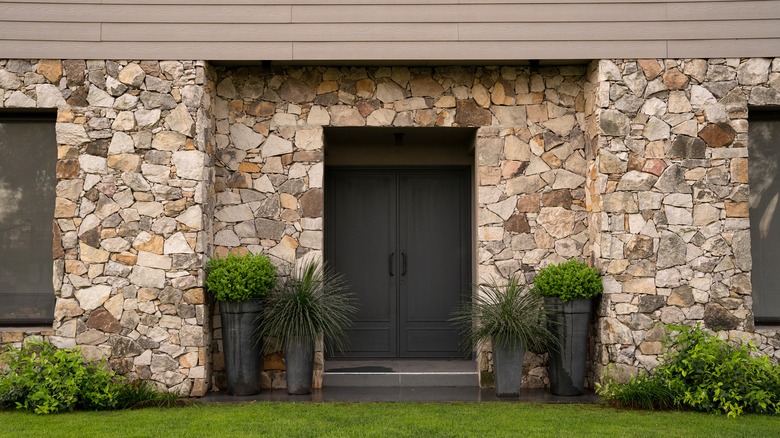 Large exterior stone home accent