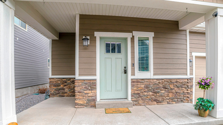 Home with beige stone wainscotting