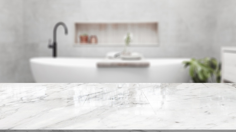 bathroom with marble countertop