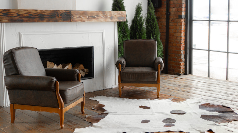 animal hide rug with chairs