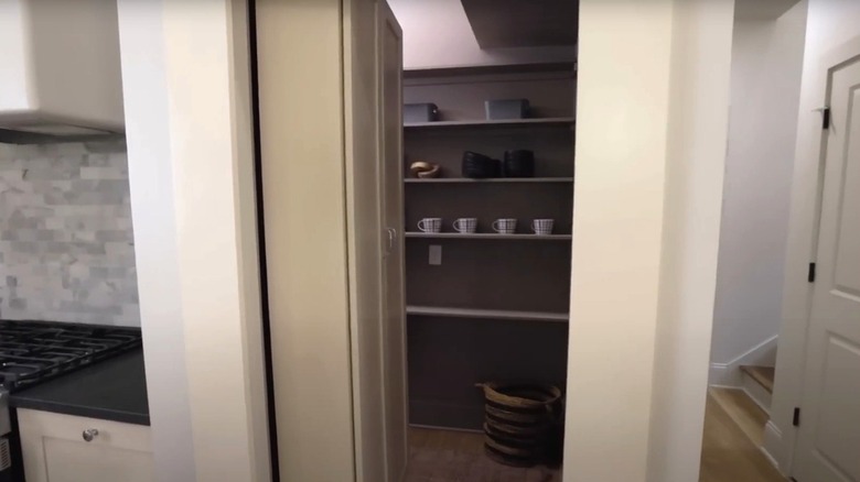 A secret pantry behind a cabinet.
