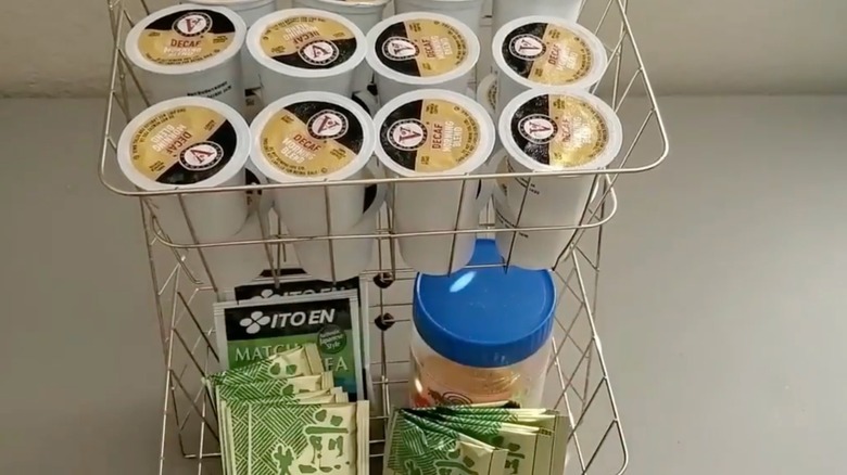 Coffee pods, tea satchets, and sugar in wire tray holder