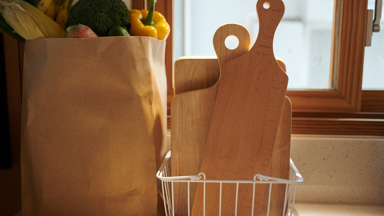 Cutting boards in wire tray on countertop