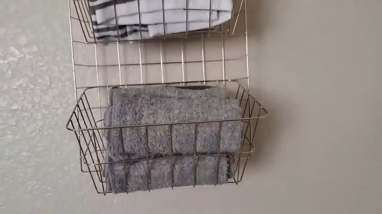 Rolled towels in wire tray