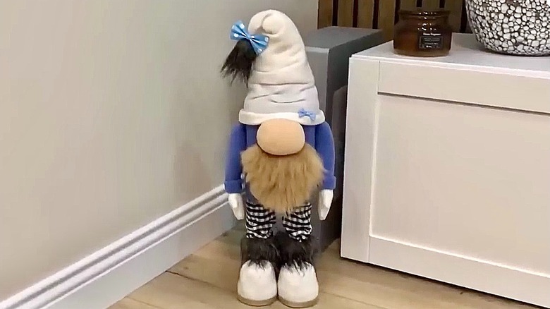 A garden gnome craft with detergent cap feet.