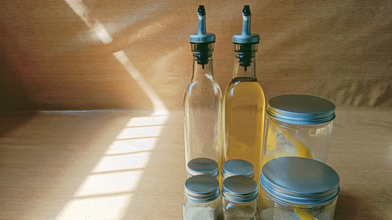 glass bottles filled with condiments
