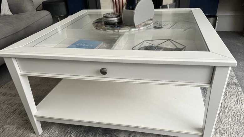 white wood table with glass top