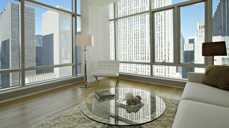 large glass coffee table in a modern loft