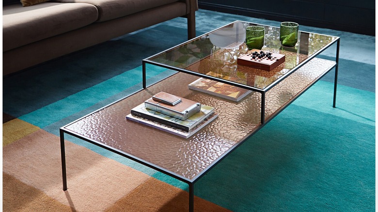 orange textured coffee table on a blue carpet