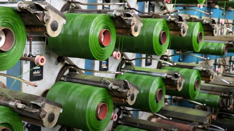 Synthetic turf manufacturing plant production process