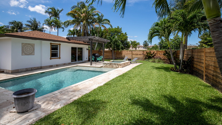 Artifical lawn backyard with shade from trees
