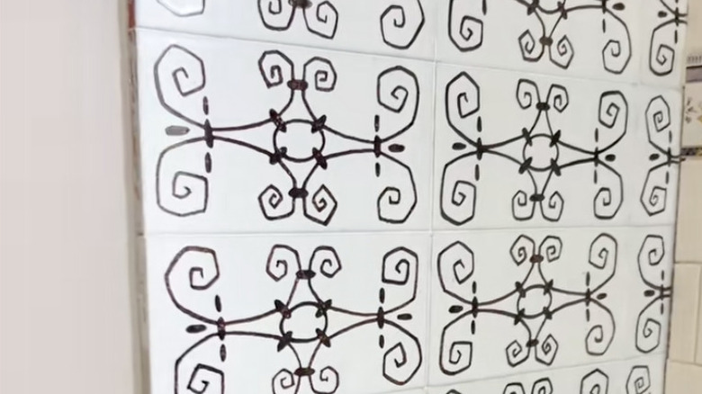 Hand-painted tile on kitchen wall