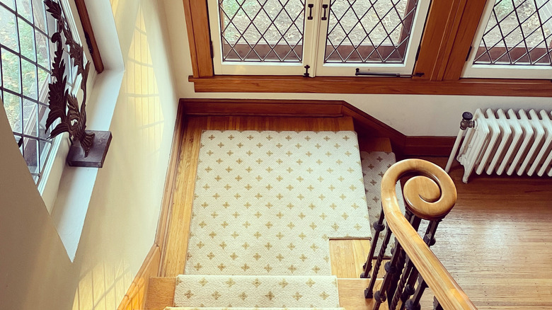 Wood banister and window frames in Craftsman home