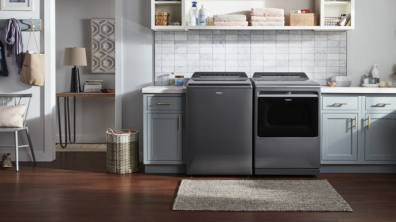 Whirlpool's 7.4-cubic-feet Vented Electric Dryer with Steam Cycle in a kitchen alongside a Whirlpool washer