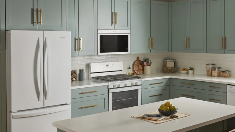 A kitchen fitted with Whirlpool's Flush Built-In Over-the-Range Microwave (in white)