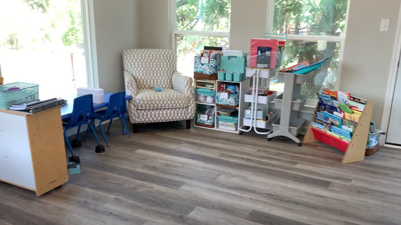chair, shelves, and desk area