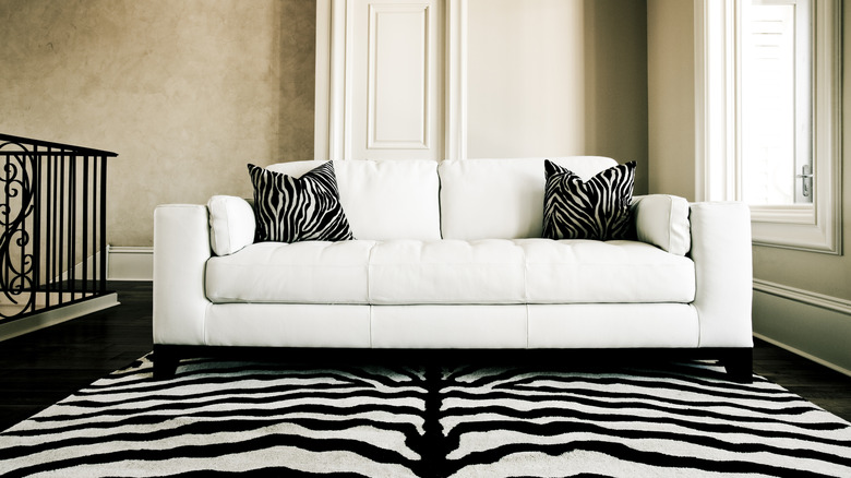Living room with zebra print rug and pillows