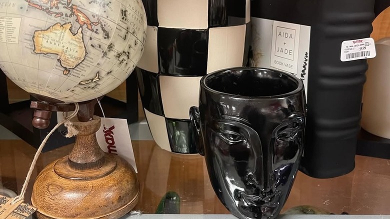 A collection of vases and other décor accessories on shelves at T.J. Maxx