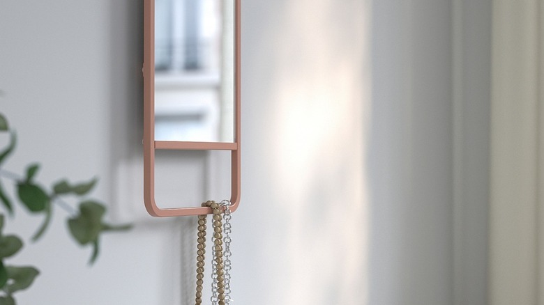 IKEA pink mirror used in entryway for neat storage hack