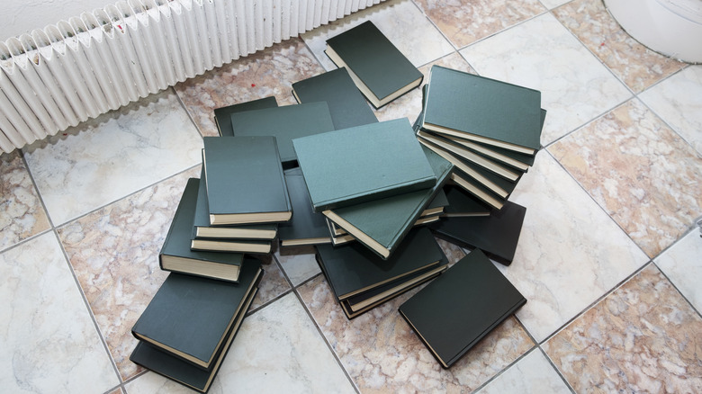 A pile of books on the floor
