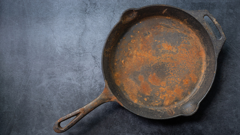 Close up of rusty cast iron pan