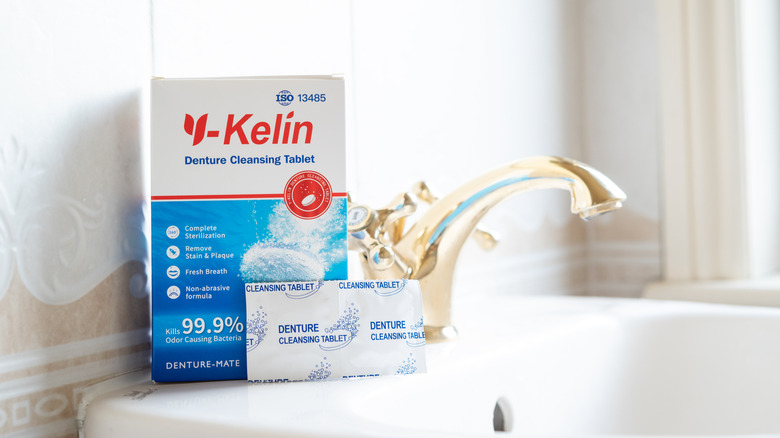 Denture cleaning tablets on a bathroom sink