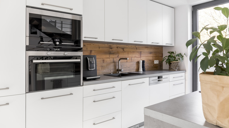 A kitchen with double ovens