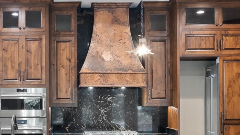 Closeup of a large copper stove hood