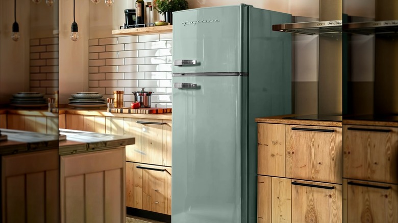 Green Frigidaire top-freezer refrigerator in a kitchen