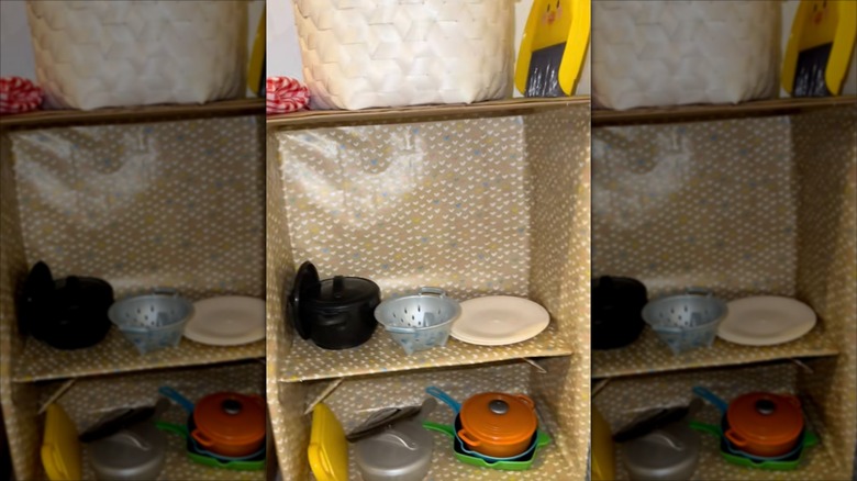 Storage unit made out of repurposed cardboard boxes to use with kids play kitchen.