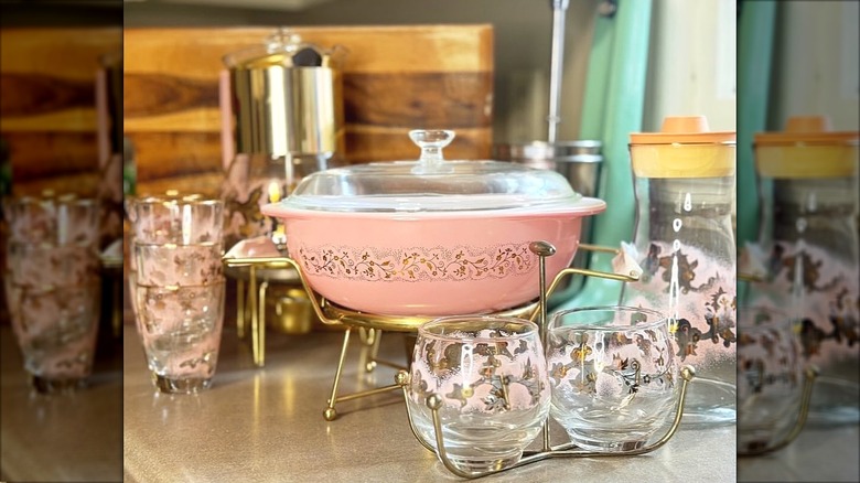 Pyrex and Stanley Home Products collaboration Duchess set with a casserole, glasses, juice carafe, percolator, and creamer/sugar set.