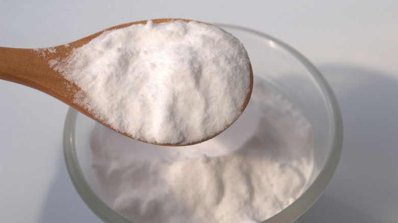 Close up of baking soda on wooden spoon