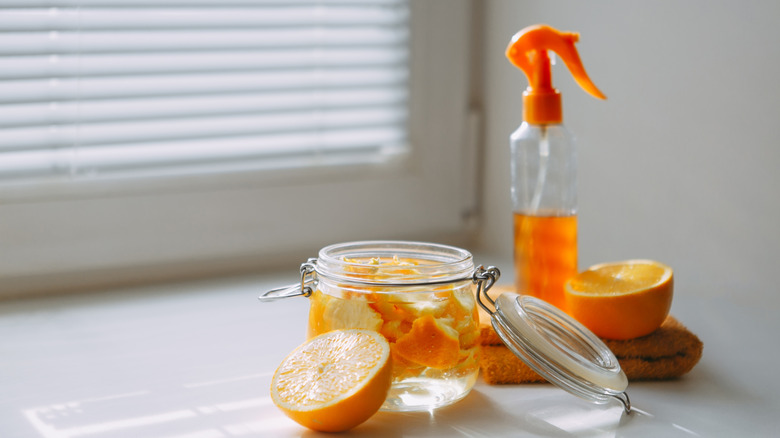 Close up of orange peels with spray bottle of vinegar