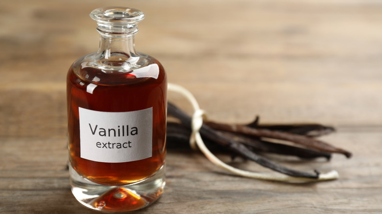 Close up of vanilla extract bottle on table