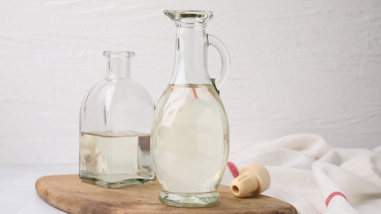 Close up of two glass bottles of white vinegar