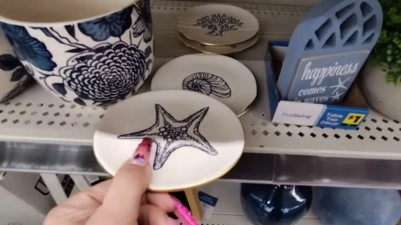 Assorted costal trinket trays displayed on shelf