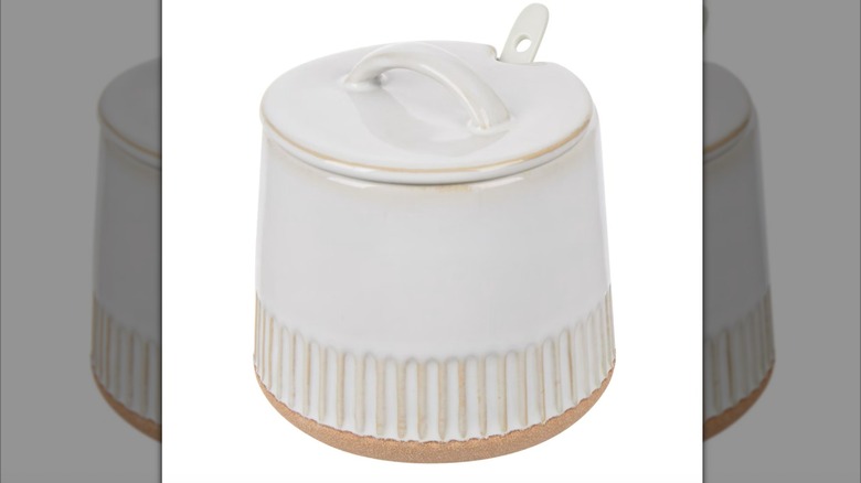 white ceramic sugar bowl with lid ajar