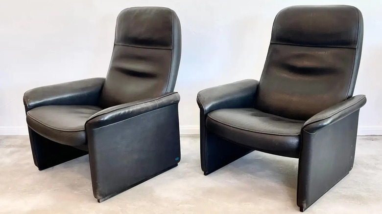 Two brown 1970s leather recliners