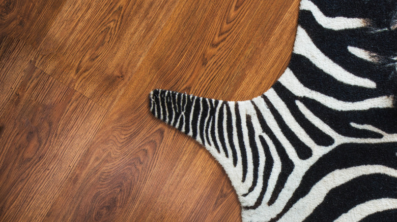 Zebra print rug on floor