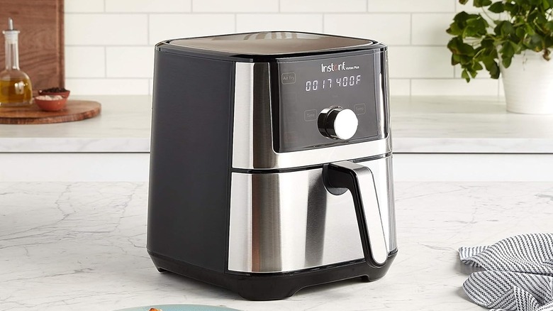 An air fryer sitting on a counter top