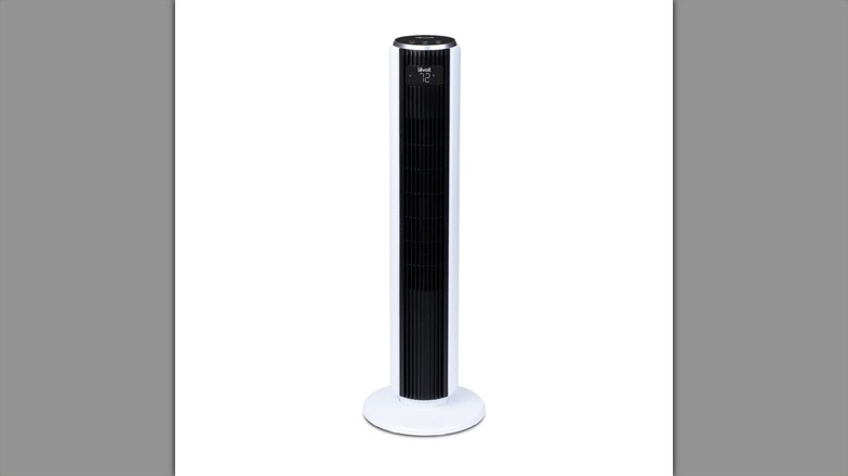 A white tower fan on a white background