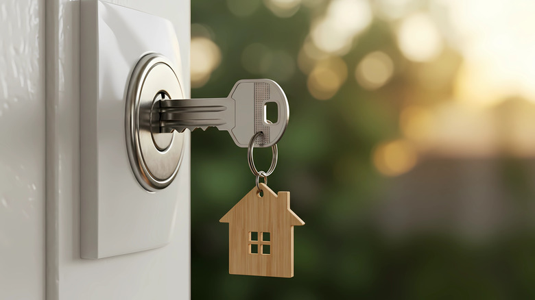 Close up of a house key in a door