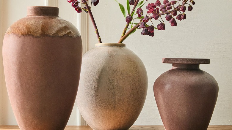 Terracotta vases sitting on a table